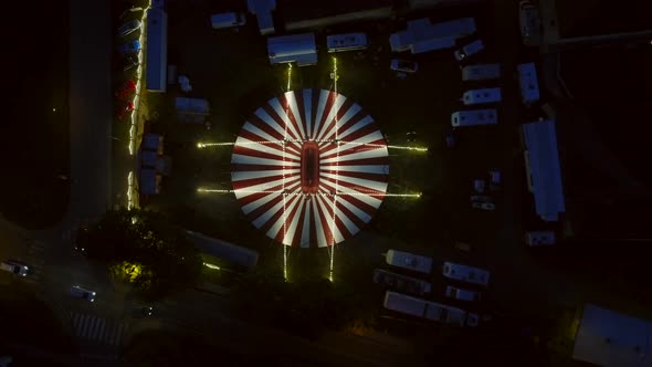 Aerial view of circus tent with camper vans parking around in Osijek.