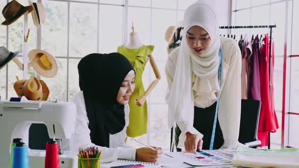 Muslim women fashion designers are in process of creating new clothes collection.