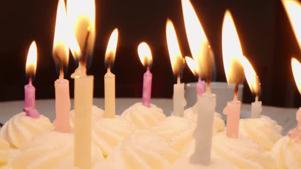 Lighted Candles on Birthday Cake