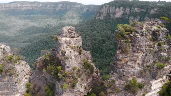 Blue Mountains National Park. Three Sisters, Beautiful Cliffs in the Middle of a Green Bush. Aerial