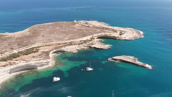 Aerial drone video from eastern Malta, Marsaxlokk area, Il-Hofra l-Kbira bay.