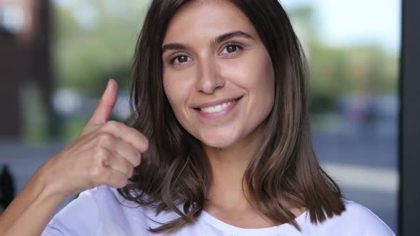 Thumbs Up by Young Girl, Close Up