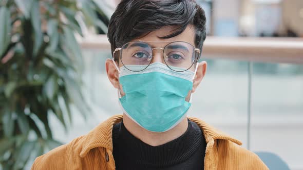 Portrait Closeup Young Indian Guy in Protective Medical Mask Standing Indoors Confident Man Posing