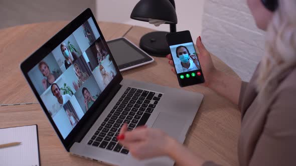 Woman Having Video Chat with Colleagues at Laptop in Office Closeup