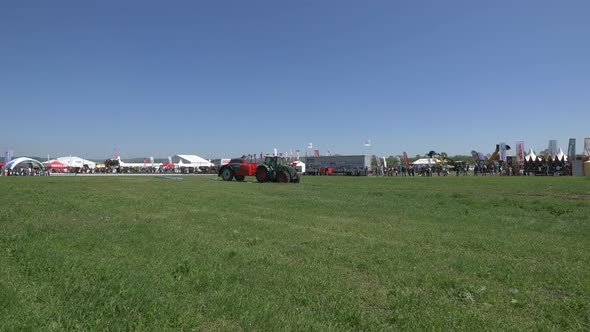 Tractor pulling trailer sprayer