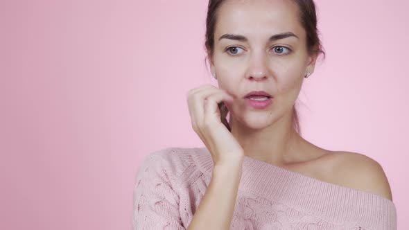 Close-up Beautiful Caucasian Hesitant Young Woman Is Nervous 