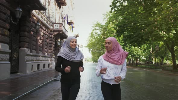 Two Muslim Ladies in Sportswear and Colorful Hijabs