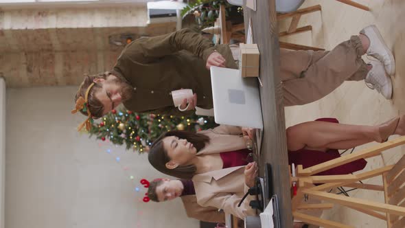 Vertical Video of Businesspeople Discussing Work in Office on Christmas