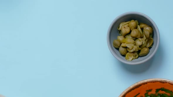 Vertical Tabletop Video Chef Puts Plate with Coocked Sweet Pea Pods to the Table