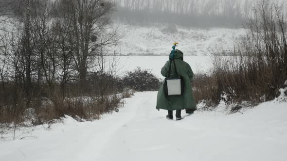 Winter fishing. Adult fisherman with professional fishing equipment