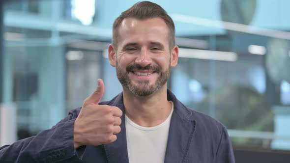 Middle Aged Businessman Showing Thumbs Up Sign