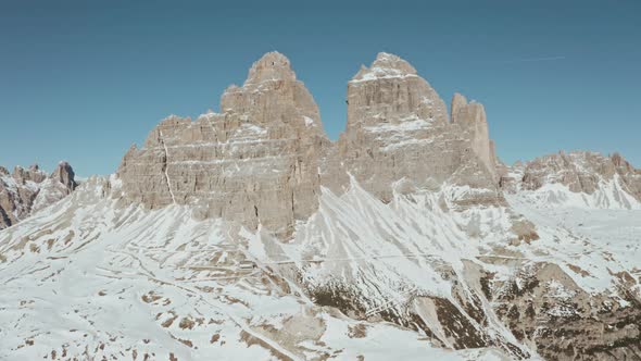 Circling drone shot of the back of tre cime mountains the dolomites italy