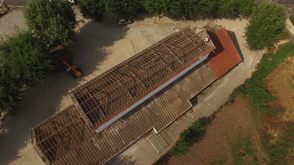 Man Remove Old Roof Aerial View