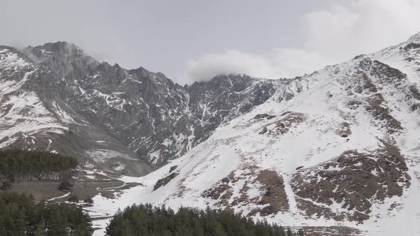 Aerial view of beautiful snowy mountains in Stepantsminda, Georgia