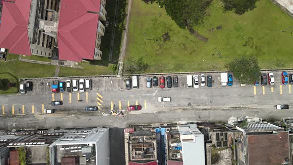 Aerial view parking lot, shop lots, field and apartment in Kuala Lumpur