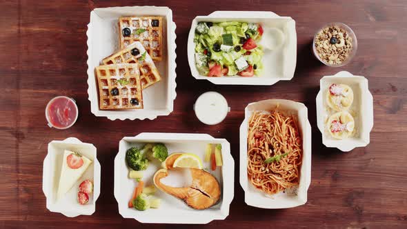 Food Delivery Top View Take Away Meals in Disposable Containers on Table