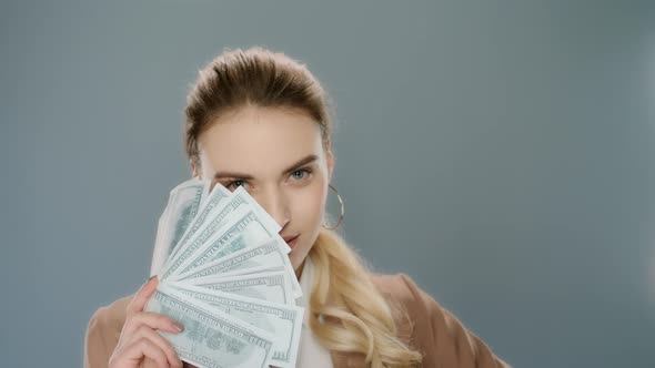 Sensual Woman Holding Money Fan. Young Business Woman Showing Money Cash Fan