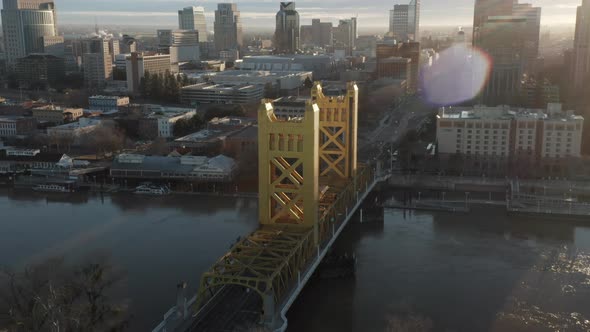 Aerial drone tilt up of Tower Bridge and Downtown Sacramento, CA, including Old Sacramento & State C