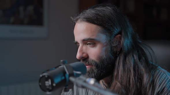 Movement Shot of a Young Bearded Vocal Coach Teaching How to Sing Online to His Audience