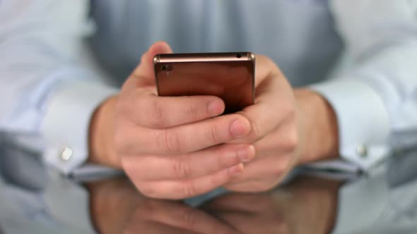 Businessman Having Rest With Smartphone in Hands, Wasting Time