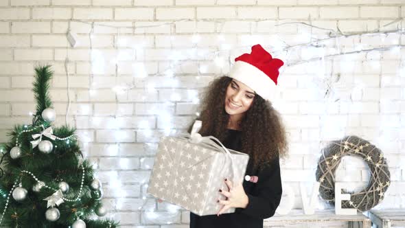 Woman Opening Gift Boxes