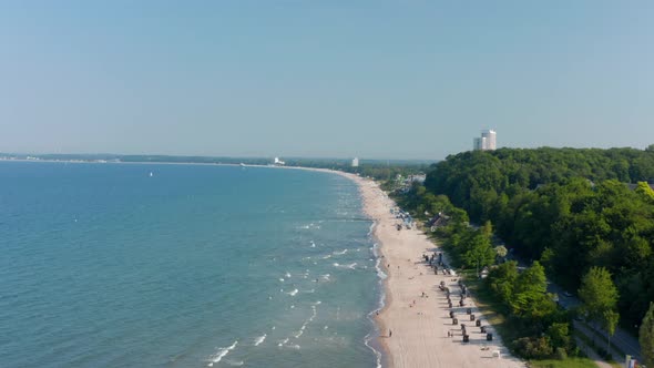 Aerial View of Beach Coastline in Scharbeutz Germany Dolly in Summertime Day