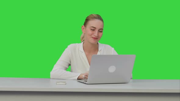 Businesswoman Working on Modern Laptop,having Video Conference with Partners on a Green Screen