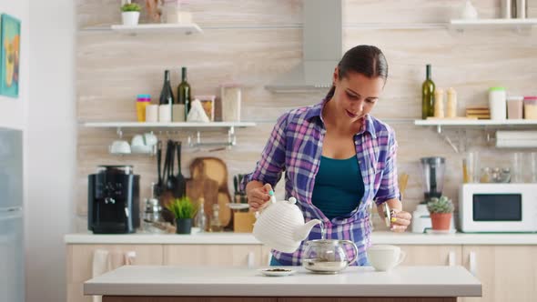 Pouring Hot Water in Teacup