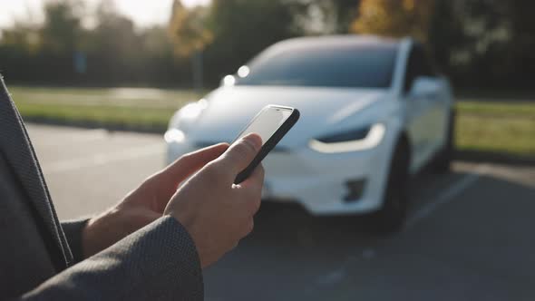 Person Controls a Self Driving Electric Car Using Mobile Application