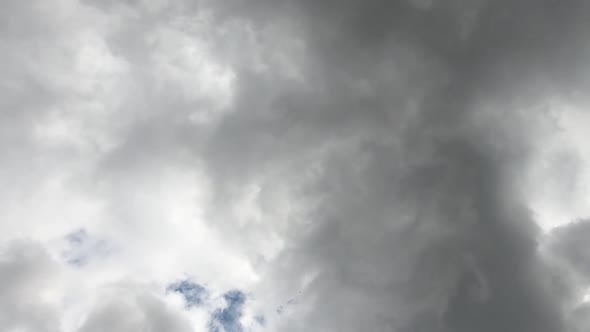 Upward view of stormy clouds moving. Time lapse
