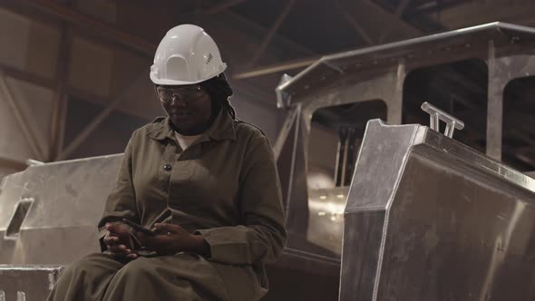 Female Worker Using Phone on Break