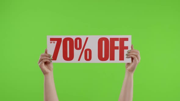 70 Percent Off Advertisement Inscription on Paper Sheet in Womans Hands on Chroma Key. Slow Motion