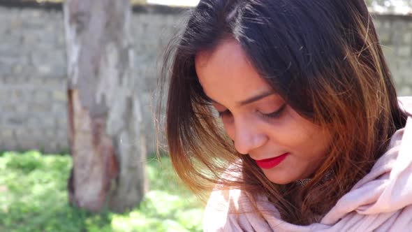 Beautiful Indian woman smiling and looking at the camera