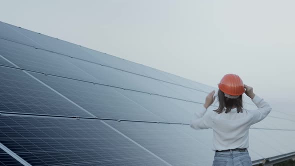 Inspector Engineer Woman Holding Digital Tablet Working in Solar Panels Power Farm