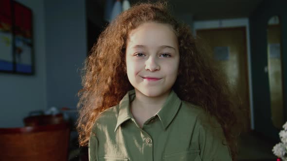 Portrait Funny Little Girl Smiling Child Looking at Camera are Sitting on the Couch at Home Cute Kid