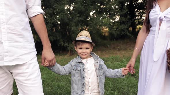 Happy Man-child Holding His Father By the Hand