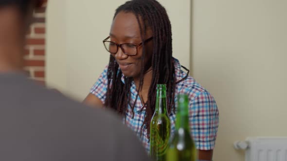 Smiling Woman Playing Chess Match with Clever Friends