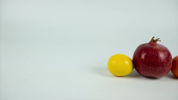 Fruits Moving in a Row on White Background. Stop Motion