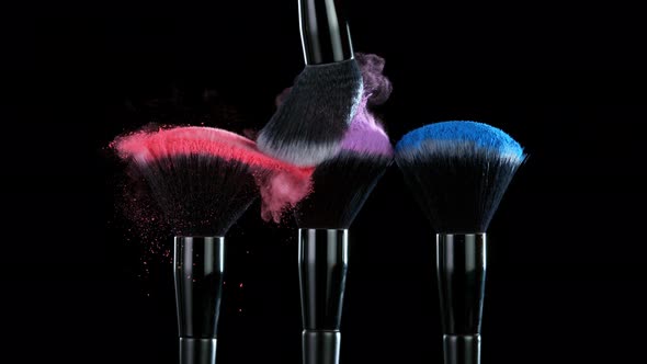 Super Slow Motion Shot of Colorful Powder and Makeup Brushes Touch Each Other at 1000 Fps