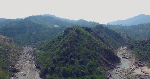 A beautiful scenery view between mountains and a river.