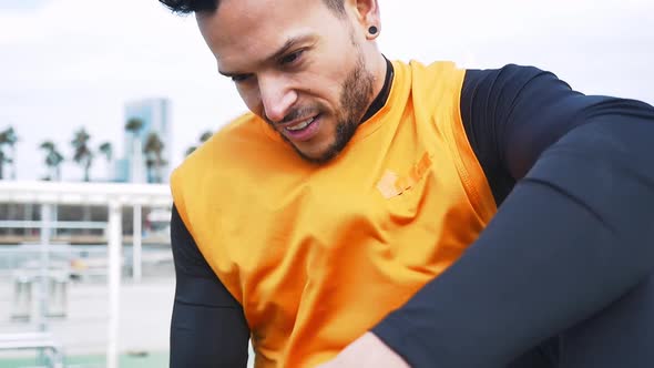 Man training at the beach outdoor gym