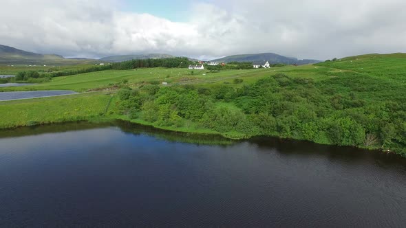 Aerial view of Scotalnd's lakes and green fields