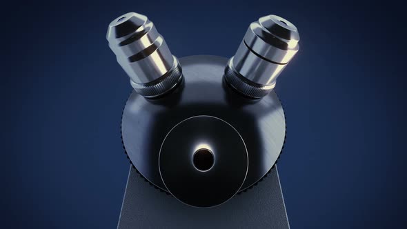 Scientific Laboratory Microscope in Dark Laboratory Changing Its Metal Lenses alt