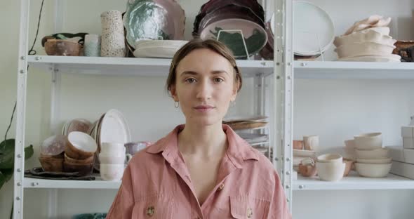 Portrait of a Young Smiling Attractive Female Potter Staying. Pottery Working, Handmade and Creative