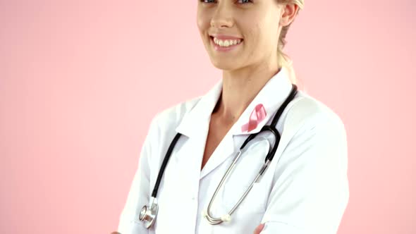 Doctor in breast cancer awareness ribbon