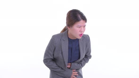 Stressed Young Asian Businesswoman Having Stomachache