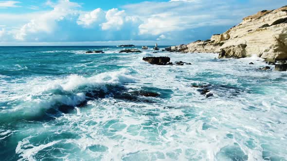 Ocean Waves Breaking on Rocks at Coast Aerial View Seashore in Stormy and Sunny Weather Cyprus