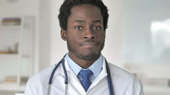 Restricting African Doctor Shaking Head To Reject