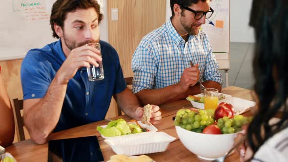 Businesspeople having meal together