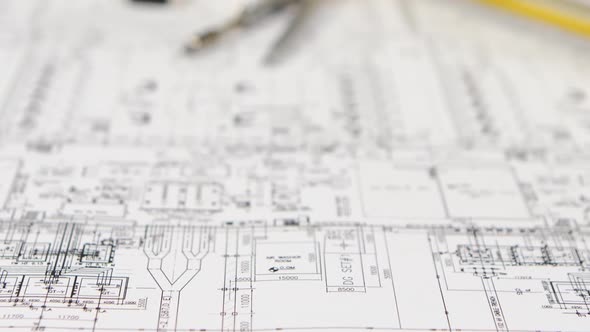 On the Table Lies a Builder , Tape Measure, Level, and Drawing. Close Up